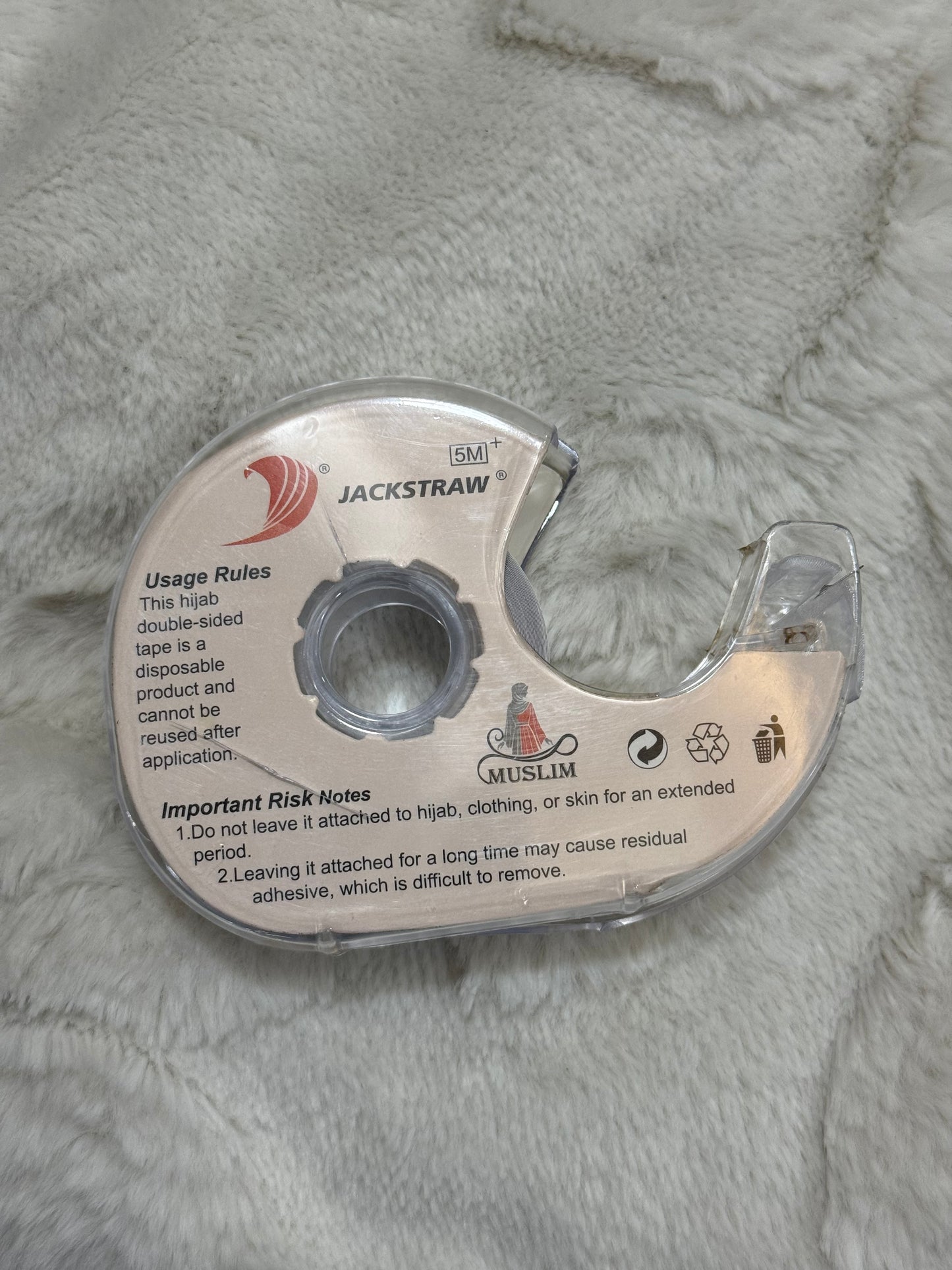 Back view of Jackstraw premium hijab double-sided tape roll in dispenser, 5 meters
