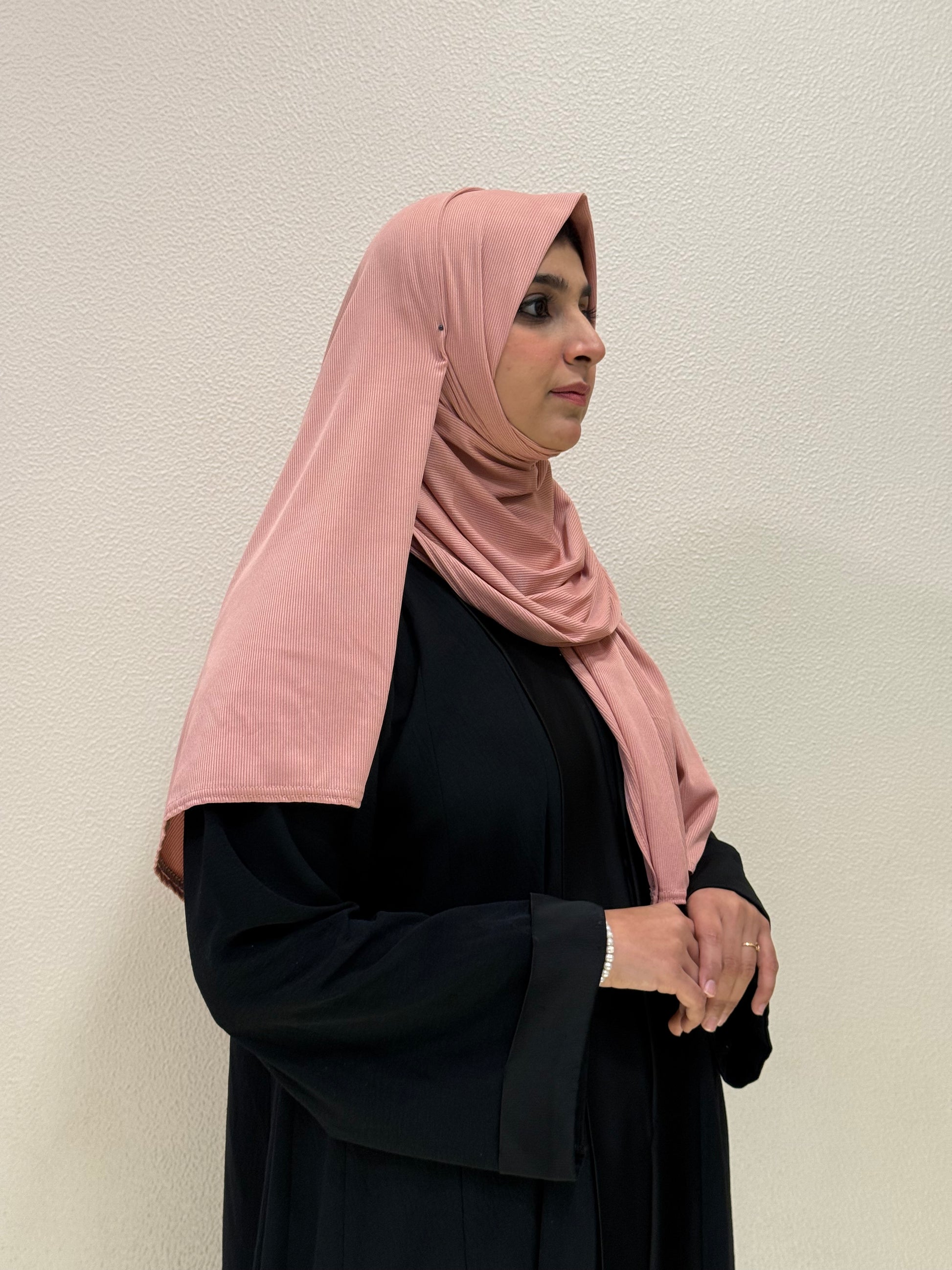 Premium pink jersey hijab product images featuring side views with soft ribbed texture, elegant drape, and full modest coverage.