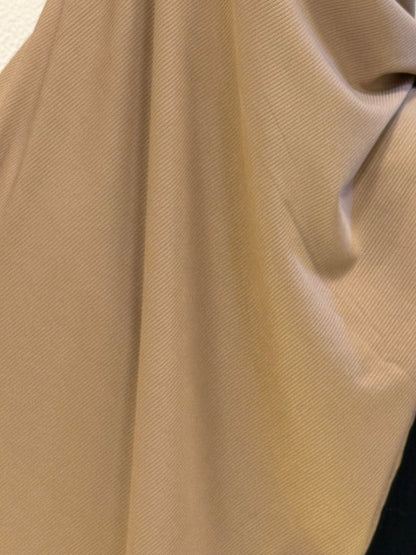 Premium jersey hijab close-up showcasing smooth stretch fabric in camel brown