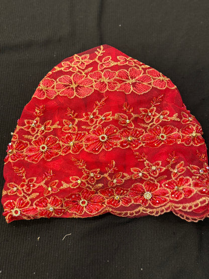 Red lace hijab cap flat lay with floral embroidery and embellishments