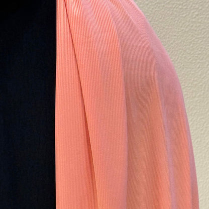 Smooth blush pink jersey hijab with premium material, fine ribbed detailing, and graceful flow for casual or formal outfits.