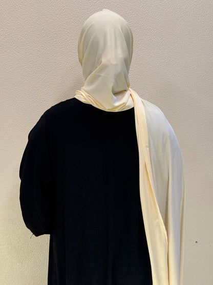 Back view of cream yellow jersey hijab showcasing long flowing design and versatile modest styling.