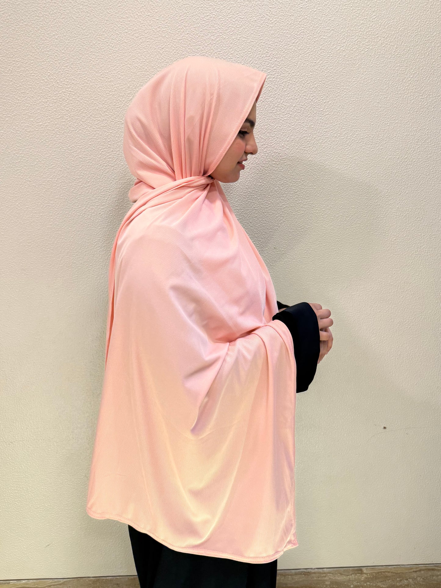 Front and side view of peach pink premium jersey hijab showcasing full coverage, lightweight comfort, and versatile everyday styling.