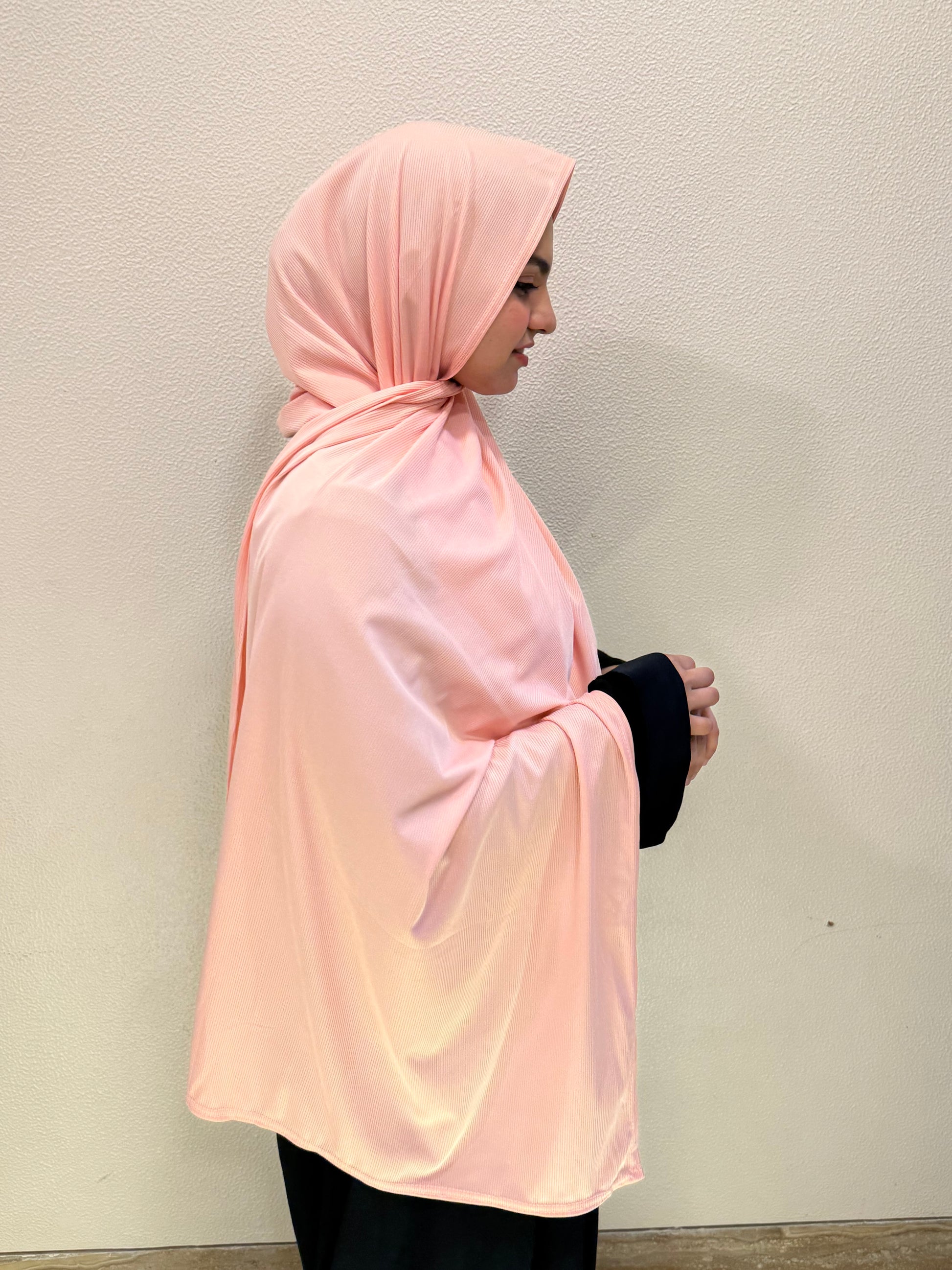 Front and side view of peach pink premium jersey hijab showcasing full coverage, lightweight comfort, and versatile everyday styling.