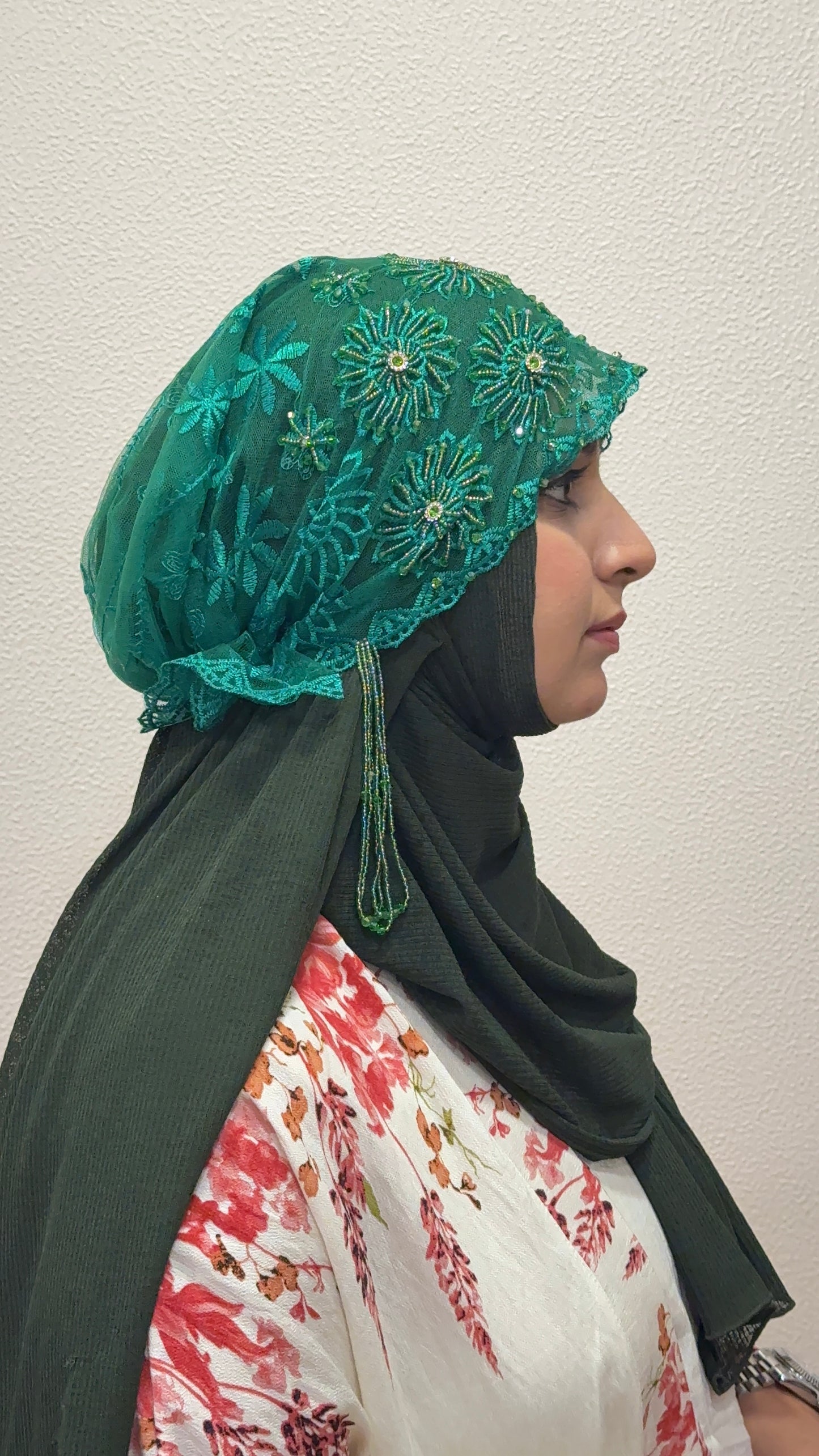 Green embroidered hijab cap side view with lace detailing