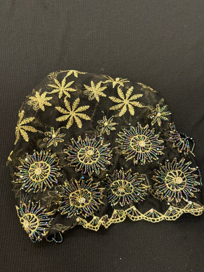 Black and gold embroidered hijab cap flat lay product display