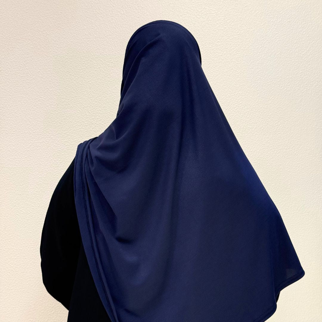 back view of navy blue jersey hijab showcasing lightweight stretch material, smooth texture, and versatile styling.