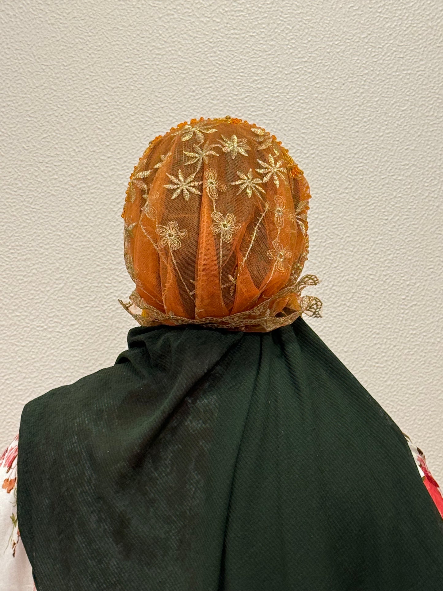 Orange embroidered hijab cap back view with lace detailing