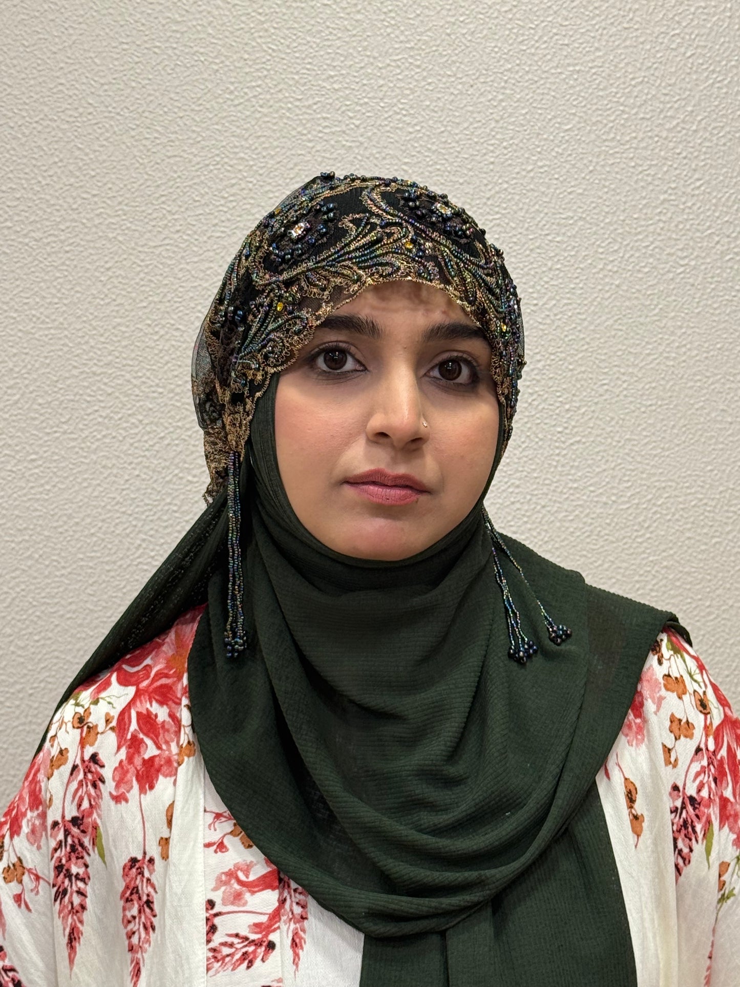 Elegant black embellished hijab cap front view close-up