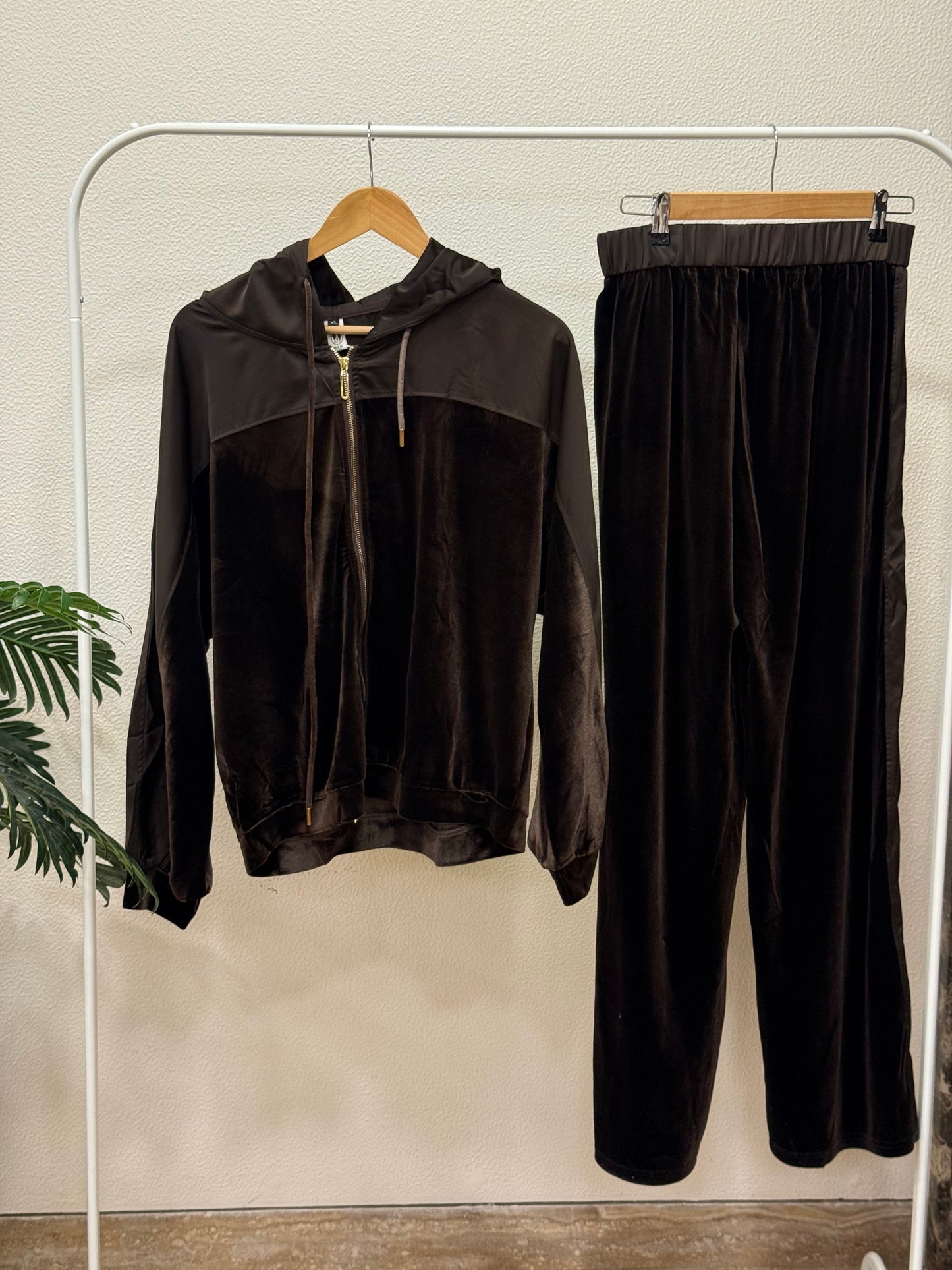 Black velvet zip-up hoodie and wide leg trouser coord set on clothing rack