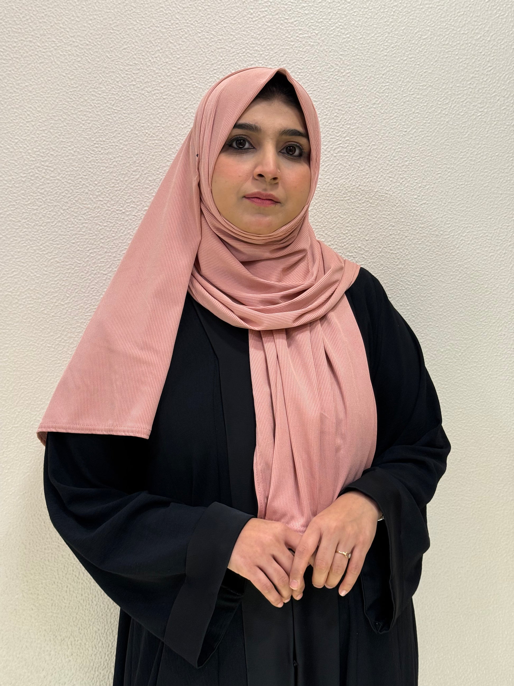 Premium pink jersey hijab product images featuring front views with soft ribbed texture, elegant drape, and full modest coverage.
