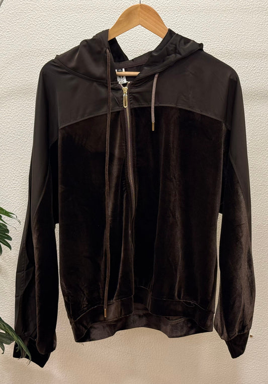Black velvet zip-up hoodie with satin panel and gold zipper detail on hanger