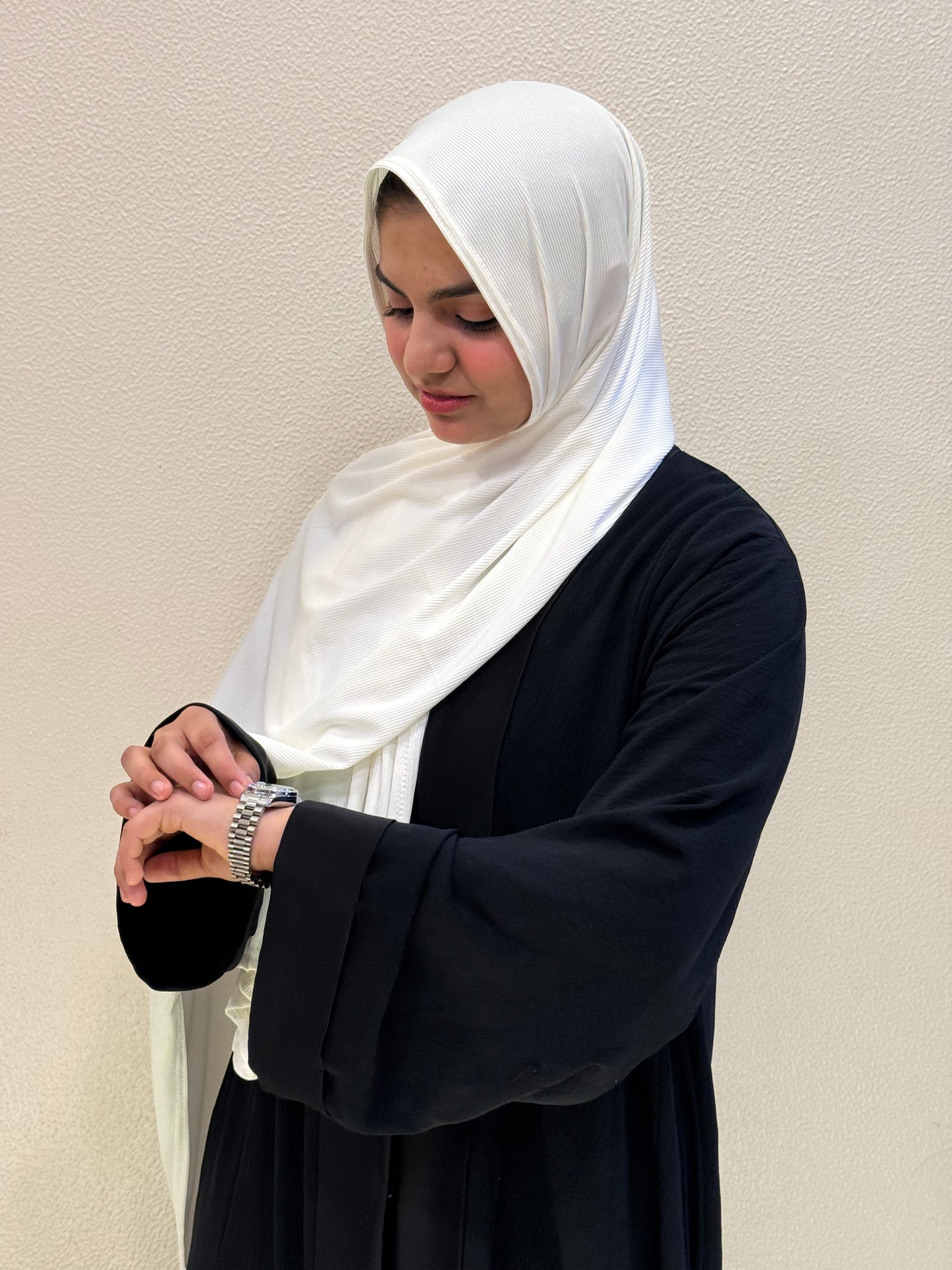 Premium jersey white hijab with soft ribbed texture, breathable fabric, and elegant drape for everyday modest fashion.