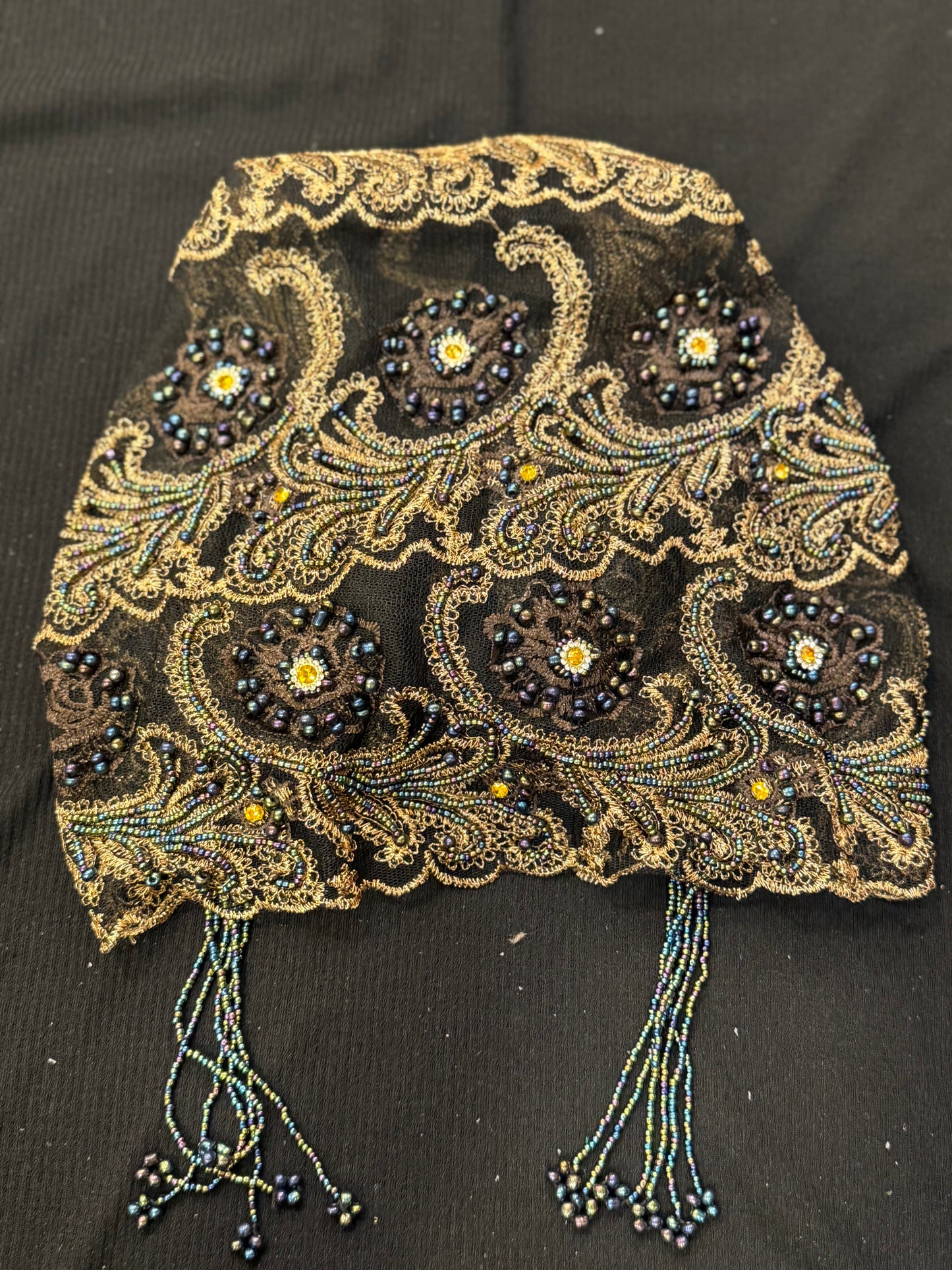 Black and gold embroidered hijab cap flat lay product display