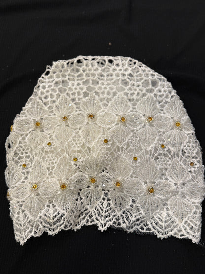 White lace hijab cap flat lay with embellished floral pattern