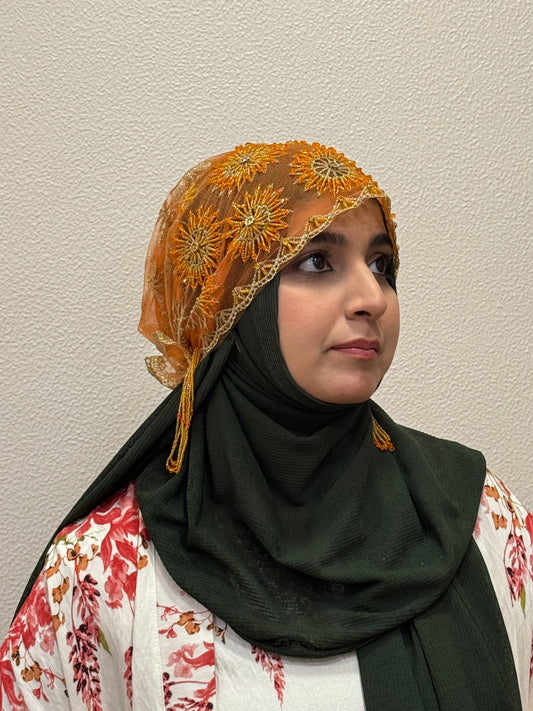 Orange party wear hijab cap side view with floral embroidery