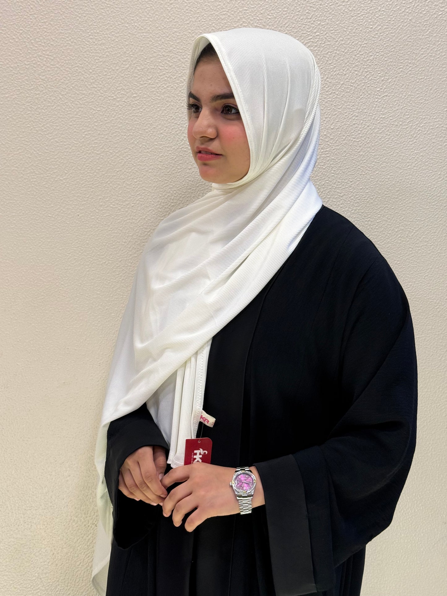 Side view of white premium jersey hijab showcasing full coverage, lightweight comfort, and versatile styling.