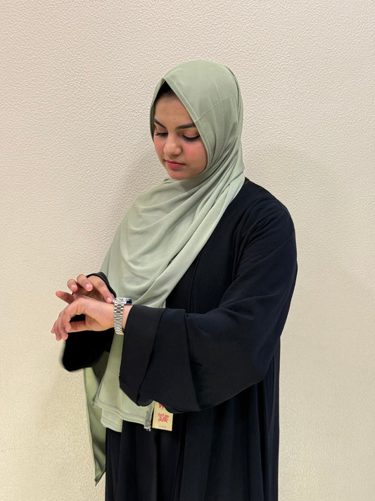 Premium soft green jersey hijab with elegant drape and breathable comfort
