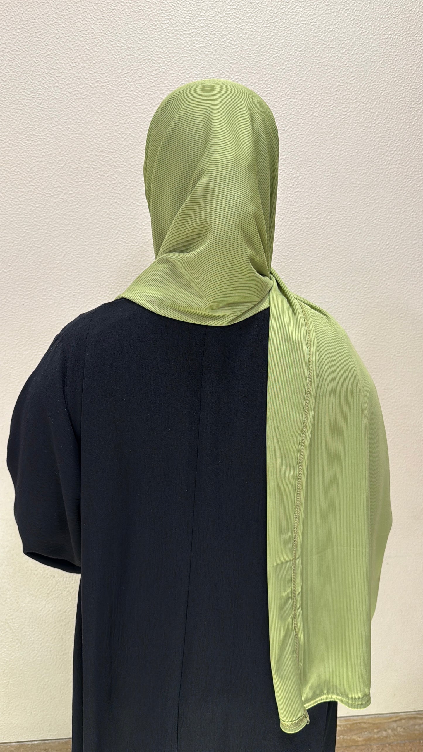 back view of light green premium jersey hijab showcasing full coverage, lightweight comfort, and versatile styling.
