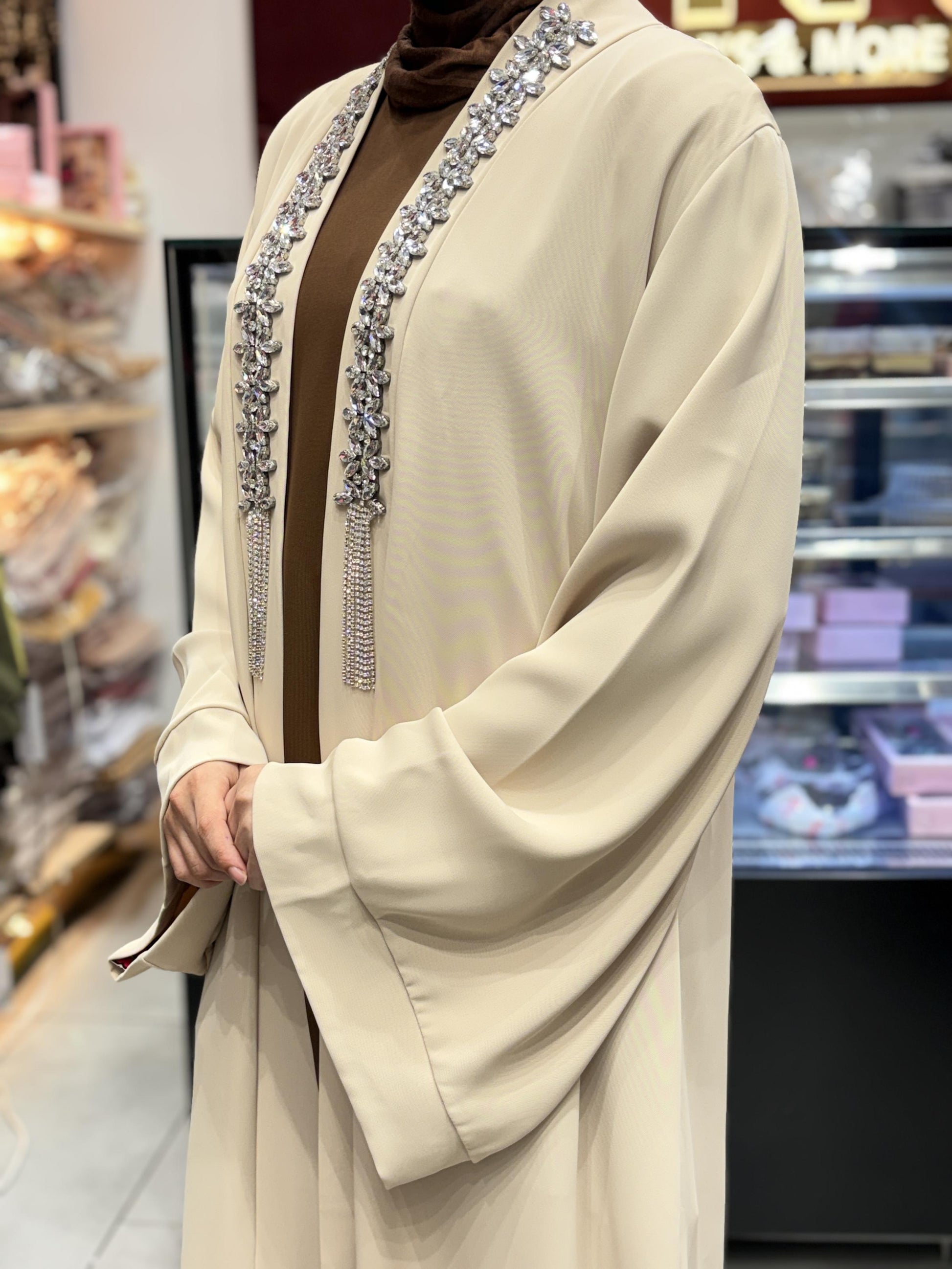 Side View Of Turkish 3 piece abaya set with hijab for women in beige and brown