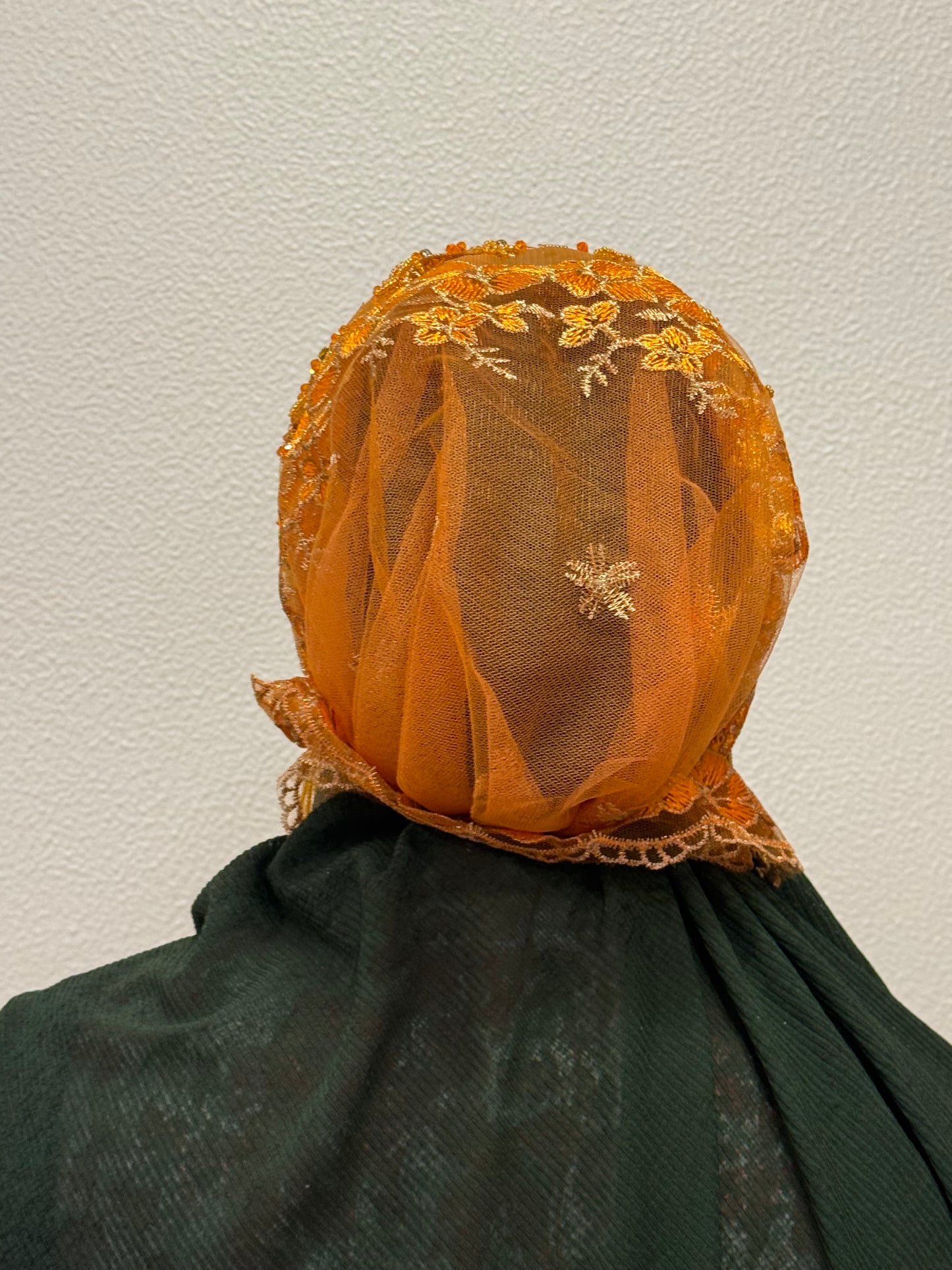 Orange embroidered hijab cap back view with lace detailing