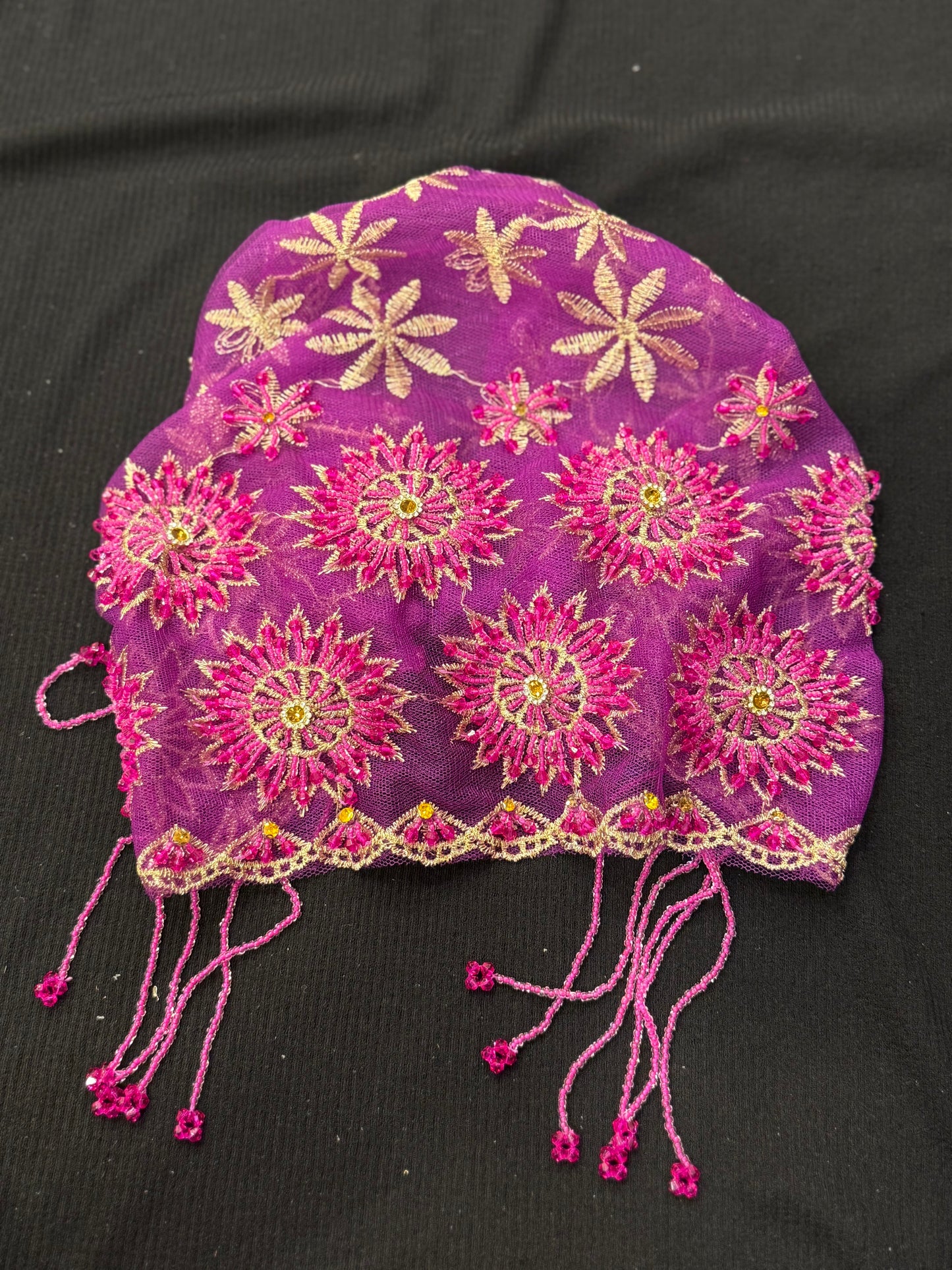 Purple lace hijab cap flat lay with embellished floral pattern