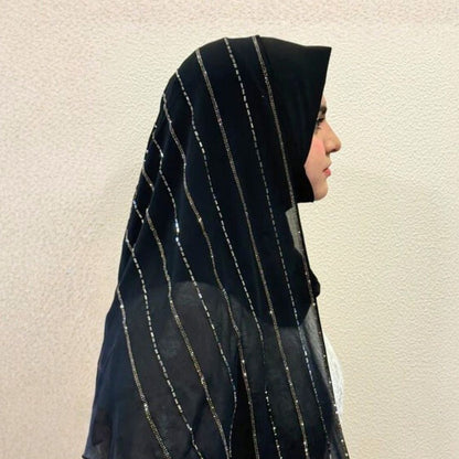 Side view of Woman wearing black instant Turkish hijab with silver glitter stripe