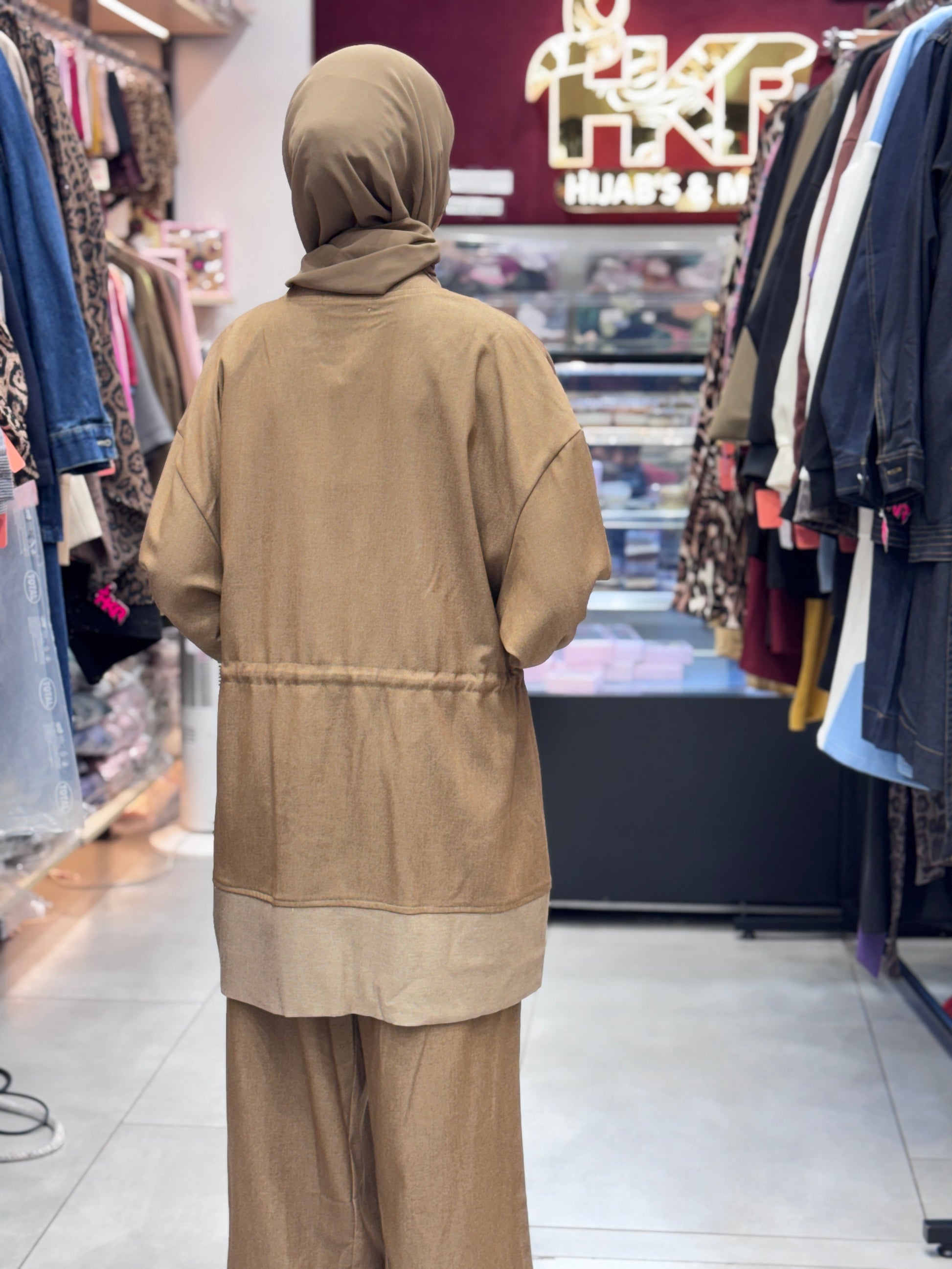 Upgrade your style with this elegant beige Turkish cord set, designed for modern modest fashion. Includes top, bottom, and matching hijab for a complete look.

Made from premium Turkish fabric for soft comfort and breathable wear, perfect for daily use and special occasions.