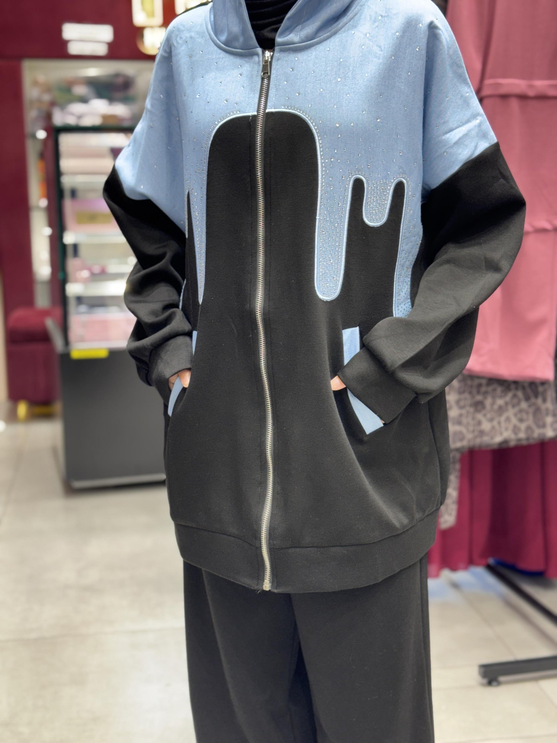 Turkish cord set front view in black and blue with hooded zip-up jacket